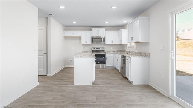 821 Merriweather Dr, King, NC 27021 - kitchen featuring stainless steel appliances, baseboards, white cabinets, and recessed lighting