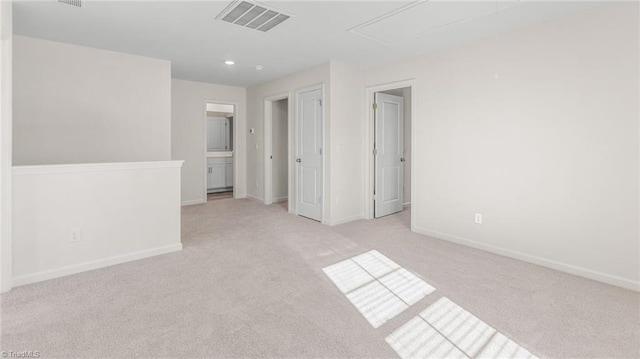 821 Merriweather Dr, King, NC 27021 - spare room featuring attic access, light carpet, baseboards, and recessed lighting