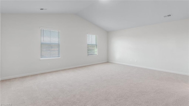 821 Merriweather Dr, King, NC 27021 - unfurnished room with vaulted ceiling, light carpet, and baseboards