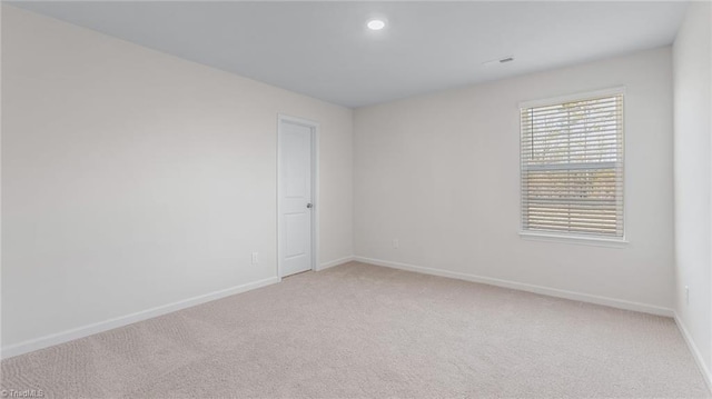 821 Merriweather Dr, King, NC 27021 - unfurnished room with light carpet, baseboards, and recessed lighting