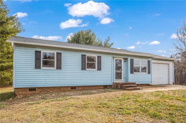 view of front of property with a garage and a front lawn