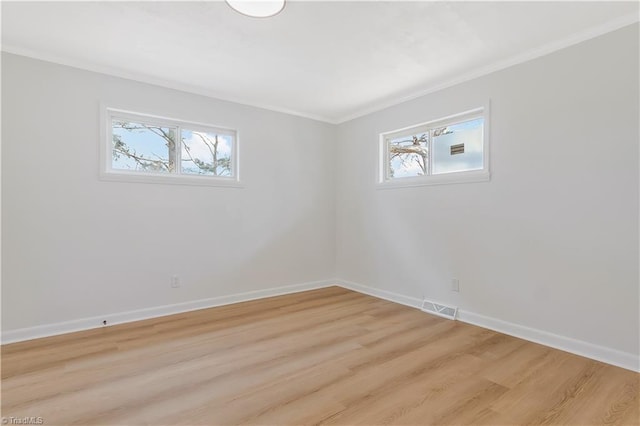 4566 Fork Rd, Norwood, NC 28128 - empty room with crown molding, plenty of natural light, light wood-style floors, and baseboards