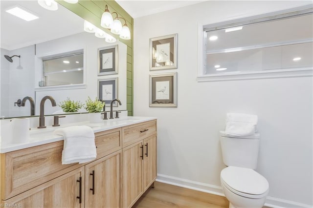 4566 Fork Rd, Norwood, NC 28128 - full bathroom featuring double vanity, wood finished floors, toilet, baseboards, and a shower