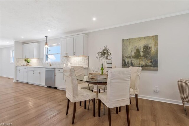4566 Fork Rd, Norwood, NC 28128 - dining space featuring ornamental molding, light wood-type flooring, baseboards, and recessed lighting