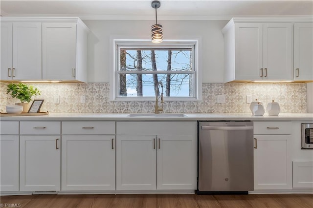 4566 Fork Rd, Norwood, NC 28128 - kitchen with dishwasher, a sink, light countertops, white cabinets, and ornamental molding