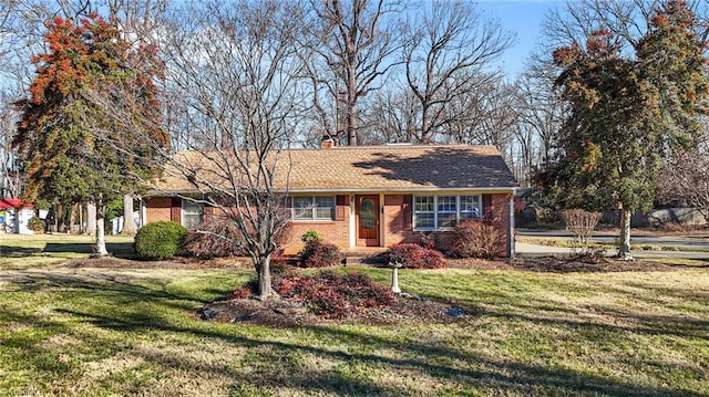 ranch-style house with a front lawn