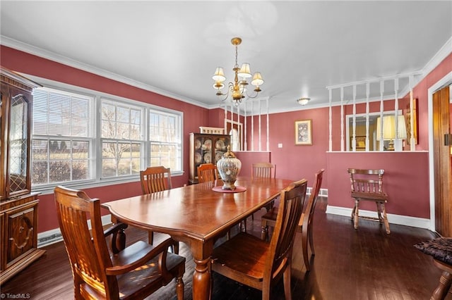 307 Jackson St, Mebane, NC 27302 - dining space featuring ornamental molding, dark wood-type flooring, and an inviting chandelier