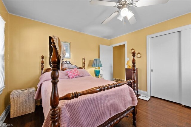 307 Jackson St, Mebane, NC 27302 - bedroom with wood-type flooring, a closet, and ceiling fan