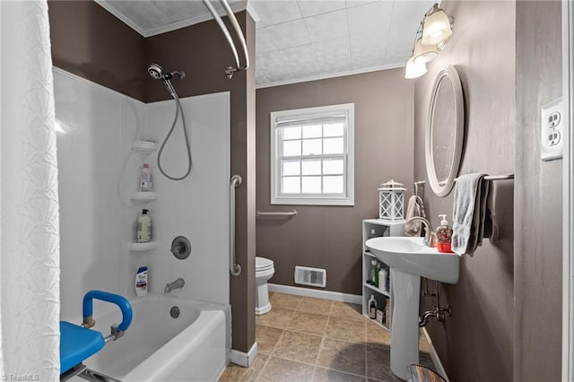 307 Jackson St, Mebane, NC 27302 - bathroom featuring tile patterned flooring, ornamental molding, toilet, and shower / bath combo