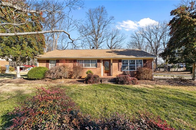 ranch-style house with a front lawn