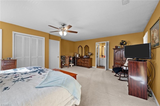 307 Jackson St, Mebane, NC 27302 - bedroom featuring ceiling fan, light colored carpet, connected bathroom, and a closet