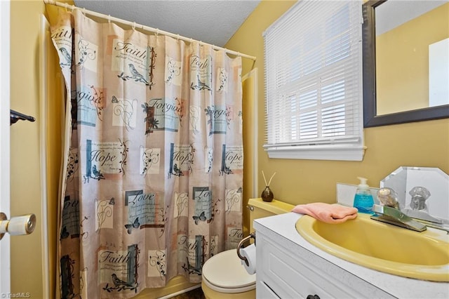 307 Jackson St, Mebane, NC 27302 - full bathroom featuring vanity, shower / bath combination with curtain, a textured ceiling, and toilet