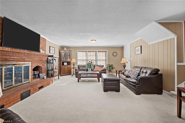 307 Jackson St, Mebane, NC 27302 - carpeted living room with a brick fireplace and a textured ceiling