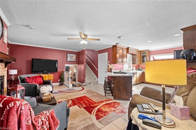 307 Jackson St, Mebane, NC 27302 - tiled living room with ceiling fan, ornamental molding, and a textured ceiling
