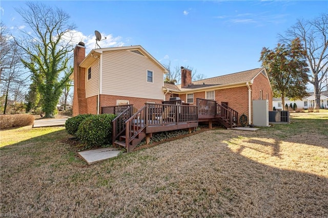 307 Jackson St, Mebane, NC 27302 - back of property featuring a yard, central AC, and a deck