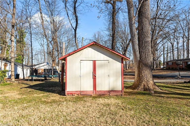 307 Jackson St, Mebane, NC 27302 - view of outdoor structure with a trampoline and a lawn