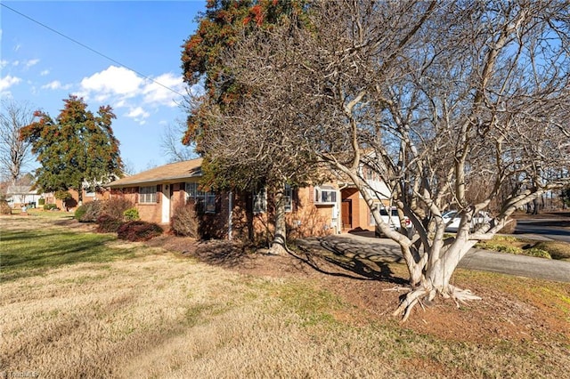 307 Jackson St, Mebane, NC 27302 - view of side of property with a lawn