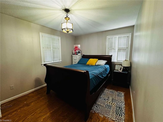 bedroom featuring dark hardwood / wood-style flooring