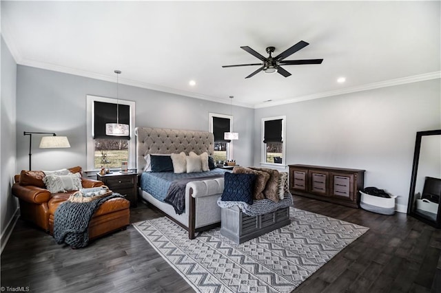 bedroom featuring dark wood-type flooring, ceiling fan, and crown molding