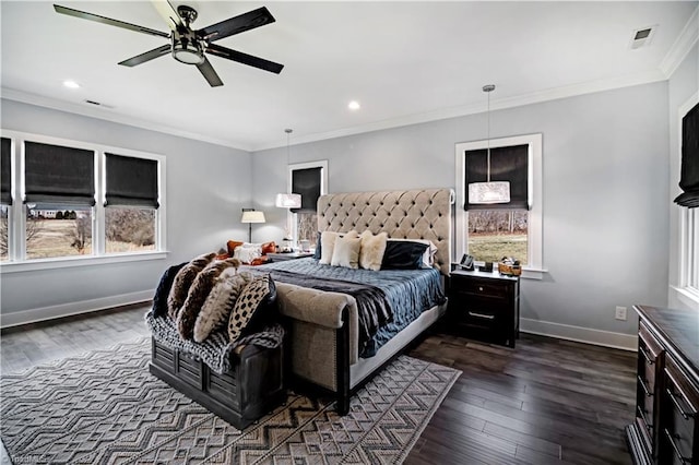 bedroom featuring crown molding, ceiling fan, and dark hardwood / wood-style floors