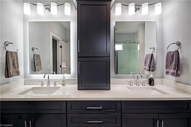 bathroom with vanity and a shower with shower door