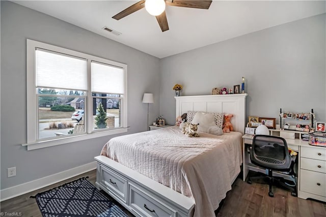 bedroom featuring ceiling fan and dark hardwood / wood-style flooring