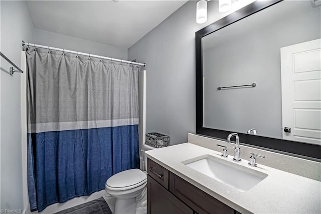 full bathroom with vanity, shower / bathtub combination with curtain, and toilet