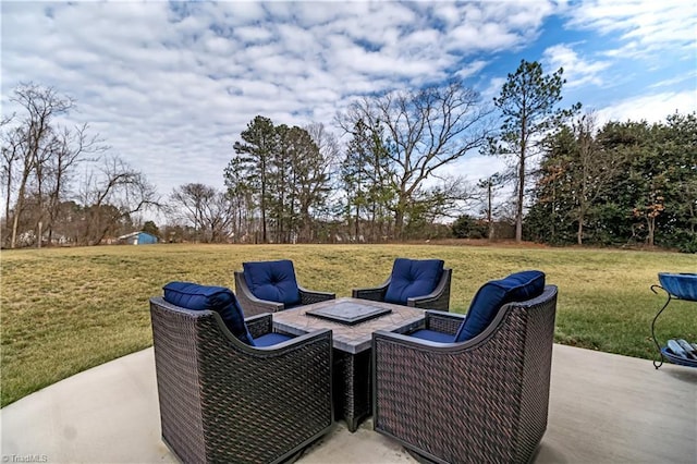 view of patio / terrace featuring an outdoor fire pit