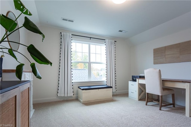 office featuring light colored carpet, visible vents, and lofted ceiling