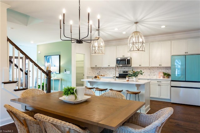 dining room with stairway, recessed lighting, and dark wood-style floors