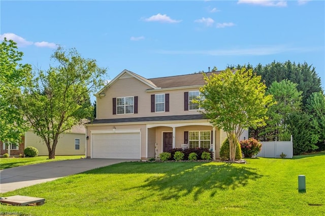 view of front of house with a garage and a front yard