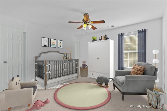 empty room with ceiling fan and light colored carpet