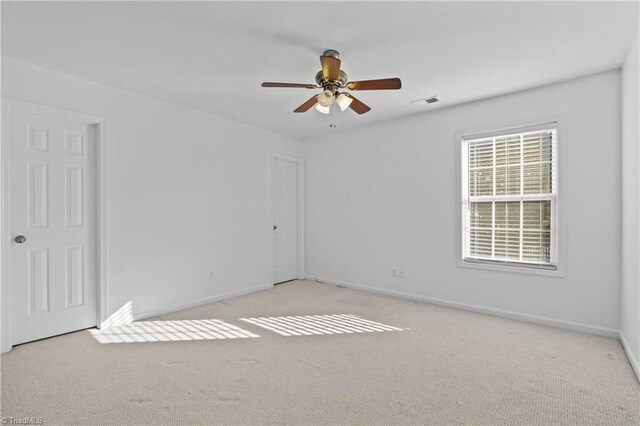 bedroom with light carpet, a closet, and ceiling fan