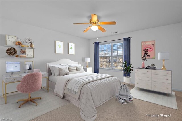 bedroom with ceiling fan and carpet flooring