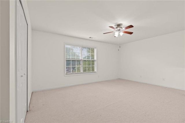 carpeted empty room with ceiling fan