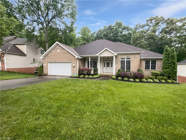 ranch-style house featuring brick siding, asphalt driveway, a front lawn, and covered porch