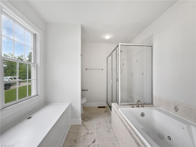 bathroom featuring toilet, a stall shower, a whirlpool tub, and marble look tile flooring