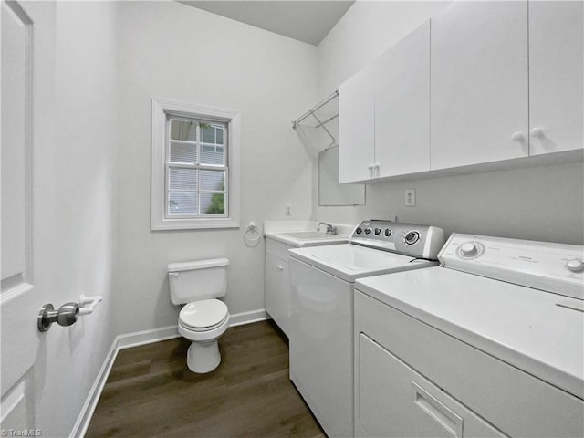 laundry room featuring independent washer and dryer, dark wood-style floors, and baseboards
