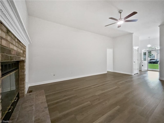 unfurnished living room with a ceiling fan, a fireplace, dark wood-style floors, baseboards, and lofted ceiling