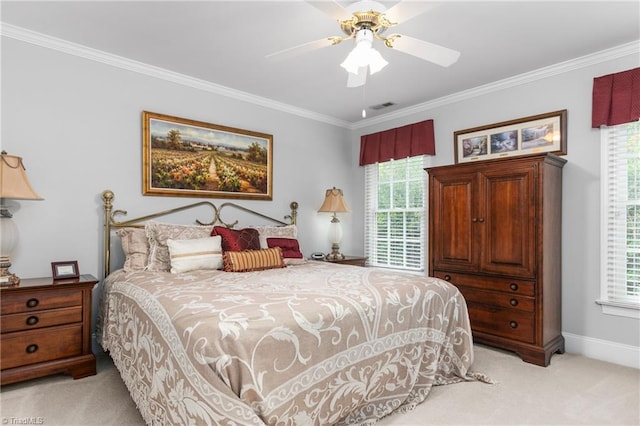 carpeted bedroom with multiple windows, ceiling fan, and crown molding