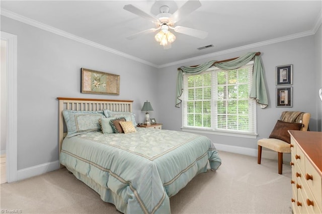 carpeted bedroom featuring ceiling fan and ornamental molding