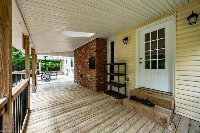 wooden deck featuring outdoor dining space