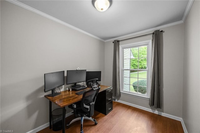 office area with baseboards, ornamental molding, and wood finished floors