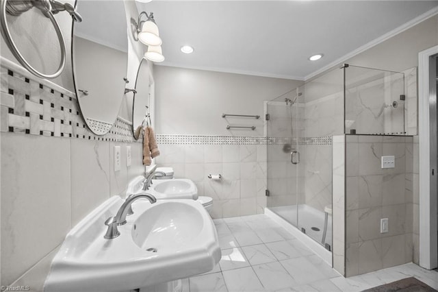 full bath with recessed lighting, a sink, marble finish floor, and a stall shower