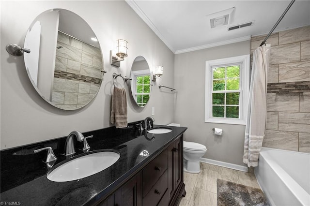 bathroom featuring visible vents, a sink, crown molding, and toilet
