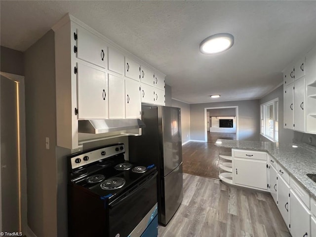 kitchen featuring white cabinetry, light hardwood / wood-style floors, range with electric stovetop, and light stone counters