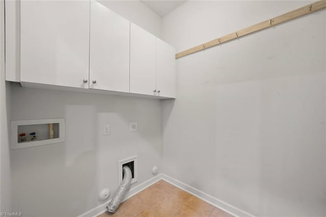 washroom with baseboards, hookup for a washing machine, gas dryer hookup, cabinet space, and hookup for an electric dryer