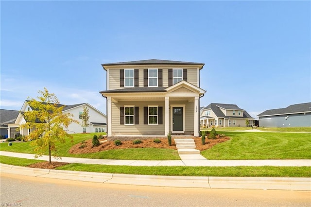 view of front of home featuring a front lawn and covered porch