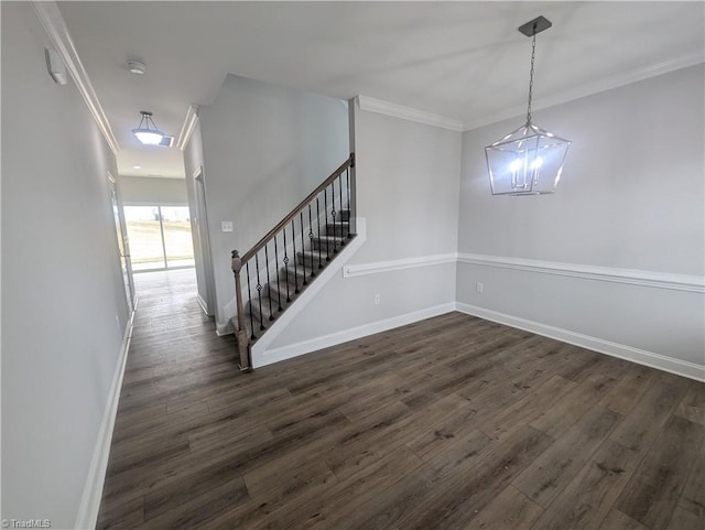 interior space featuring stairway, dark wood-type flooring, baseboards, and ornamental molding