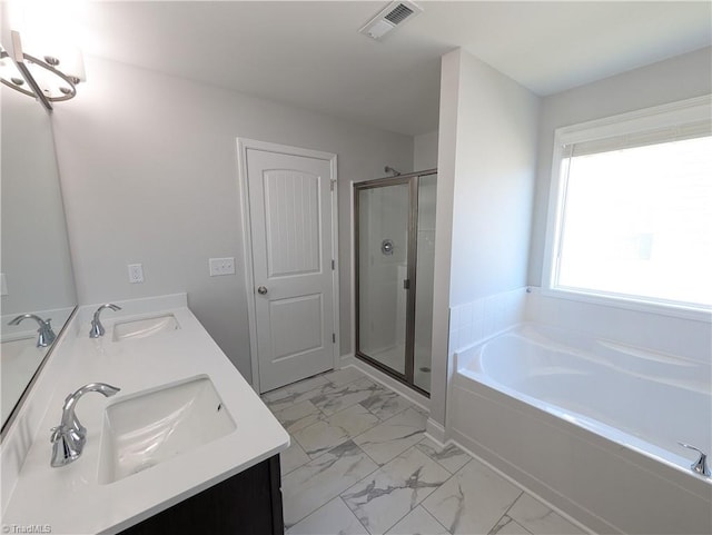 full bath featuring a sink, visible vents, a garden tub, and marble finish floor